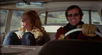 Movie still from “Five Easy Pieces” (1970), directed by Bob Rafelson – A man and a woman sitting in the back of a car; Medium shot, Over the shoulder angle