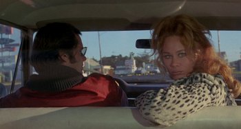Movie still from “Five Easy Pieces” (1970), directed by Bob Rafelson – A man and a woman sitting in the back of a car; Medium shot, Over the shoulder angle