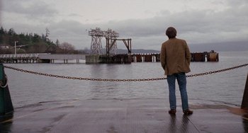 Movie still from “Five Easy Pieces” (1970), directed by Bob Rafelson – A man standing on a dock looking at a bridge; Wide shot, Low angle
