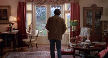 Movie still from “Five Easy Pieces” (1970), directed by Bob Rafelson – A man standing in front of a window looking outside; Wide shot, Low angle
