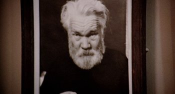 Movie still from “Five Easy Pieces” (1970), directed by Bob Rafelson – An old man with a beard is looking at the camera; Close Up shot, Low angle