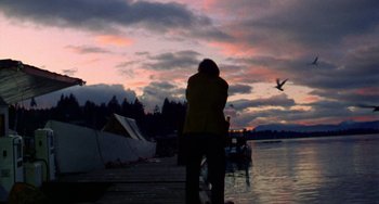 Movie still from “Five Easy Pieces” (1970), directed by Bob Rafelson – A person standing on a dock near a body of water; Wide shot, Low angle