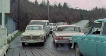 Movie still from “Five Easy Pieces” (1970), directed by Bob Rafelson – A bunch of old cars that are parked on the side of the road; Wide shot, High angle