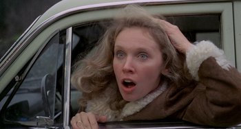 Movie still from “Five Easy Pieces” (1970), directed by Bob Rafelson – A woman in a car with her hair blowing in the wind; Close Up shot, Low angle
