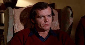 Movie still from “Five Easy Pieces” (1970), directed by Bob Rafelson – A person sitting on a couch; Close Up shot, High angle
