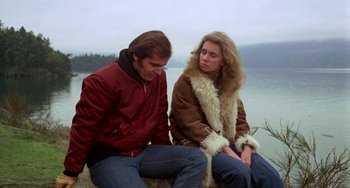 Movie still from “Five Easy Pieces” (1970), directed by Bob Rafelson – A man and a woman sitting next to each other on a rock; Medium shot, Over the shoulder angle