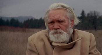 Movie still from “Five Easy Pieces” (1970), directed by Bob Rafelson – An old man with a white beard is looking into the distance; Close Up shot, Low angle