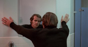 Movie still from “Five Easy Pieces” (1970), directed by Bob Rafelson – A man looking at himself in the mirror; Close Up shot, Over the shoulder angle