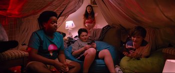 Movie still from “Good Boys” (2019), directed by Gene Stupnitsky – A group of people sitting around a room; Wide shot, High angle