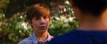 Movie still from “Good Boys” (2019), directed by Gene Stupnitsky – A young boy is looking into the distance; Close Up shot, Over the shoulder angle