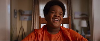Movie still from “Good Boys” (2019), directed by Gene Stupnitsky – A young boy smiling with his mouth wide open; Close Up shot, Low angle
