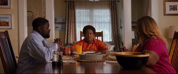 Movie still from “Good Boys” (2019), directed by Gene Stupnitsky – A boy sitting at a table with a plate of food; Medium shot, Over the shoulder angle