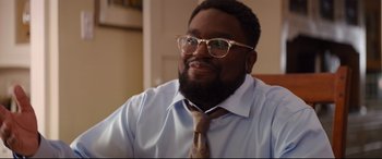 Movie still from “Good Boys” (2019), directed by Gene Stupnitsky – A person wearing glasses and a tie; Close Up shot, Over the shoulder angle