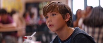Movie still from “Good Boys” (2019), directed by Gene Stupnitsky – A young boy is looking into the distance; Close Up shot, Over the shoulder angle