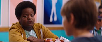 Movie still from “Good Boys” (2019), directed by Gene Stupnitsky – Two young boys are sitting at a table and talking; Close Up shot, Over the shoulder angle