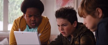 Movie still from “Good Boys” (2019), directed by Gene Stupnitsky – Two young boys looking at a laptop computer screen; Close Up shot, Low angle