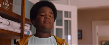 Movie still from “Good Boys” (2019), directed by Gene Stupnitsky – A young boy with his eyes closed with his eyes closed; Close Up shot, Low angle