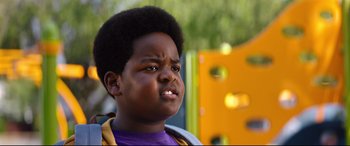 Movie still from “Good Boys” (2019), directed by Gene Stupnitsky – A young boy with a yellow and black shirt; Close Up shot, Low angle