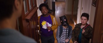 Movie still from “Good Boys” (2019), directed by Gene Stupnitsky – Two boys in costumes in a hallway of a house; Medium shot, Over the shoulder angle