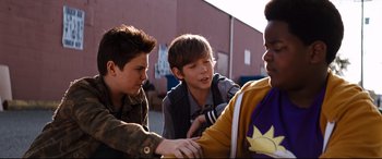 Movie still from “Good Boys” (2019), directed by Gene Stupnitsky – A group of young people standing next to each other on the street; Medium shot, Over the shoulder angle