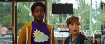 Movie still from “Good Boys” (2019), directed by Gene Stupnitsky – Two young boys standing next to each other in front of a building; Close Up shot, Low angle