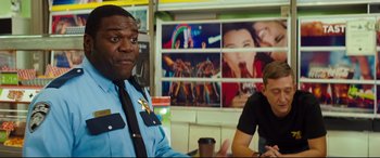 Movie still from “Good Boys” (2019), directed by Gene Stupnitsky – A police officer sitting in front of another officer; Medium shot, Over the shoulder angle