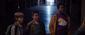 Movie still from “Good Boys” (2019), directed by Gene Stupnitsky – Two young men standing in a hallway next to each other; Medium shot, Over the shoulder angle