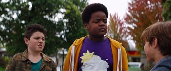 Movie still from “Good Boys” (2019), directed by Gene Stupnitsky – A young boy wearing a purple shirt and a yellow jacket; Close Up shot, Low angle