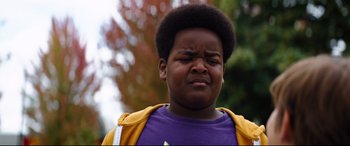 Movie still from “Good Boys” (2019), directed by Gene Stupnitsky – A person wearing a purple shirt; Close Up shot, Low angle