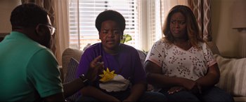 Movie still from “Good Boys” (2019), directed by Gene Stupnitsky – Two women and a man sitting on a couch; Medium shot, Over the shoulder angle