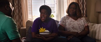 Movie still from “Good Boys” (2019), directed by Gene Stupnitsky – A young boy sitting on a couch next to an older woman; Medium shot, Over the shoulder angle