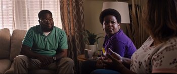 Movie still from “Good Boys” (2019), directed by Gene Stupnitsky – Two men sitting in a living room talking to each other; Medium shot, Over the shoulder angle