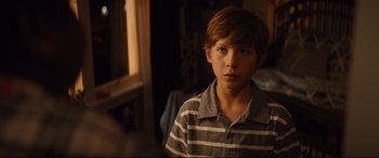 Movie still from “Good Boys” (2019), directed by Gene Stupnitsky – A boy in a striped shirt stares at the camera; Close Up shot, Over the shoulder angle