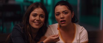 Movie still from “Good Boys” (2019), directed by Gene Stupnitsky – Two young women posing for a picture together; Close Up shot, Over the shoulder angle