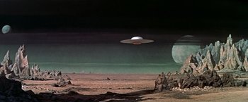 Movie still from “Forbidden Planet” (1956), directed by Fred M. Wilcox – An image of an alien invasion in the desert; Extreme Wide shot, Low angle