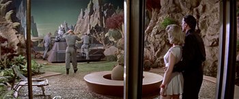 Movie still from “Forbidden Planet” (1956), directed by Fred M. Wilcox – A group of people standing in a field; Wide shot, Over the shoulder angle