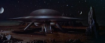 Movie still from “Forbidden Planet” (1956), directed by Fred M. Wilcox – An image of an alien spaceship in the middle of the night; Extreme Wide shot, High angle