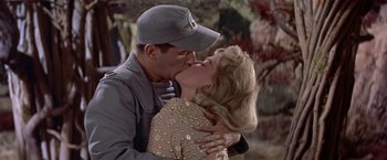 Movie still from “Forbidden Planet” (1956), directed by Fred M. Wilcox – A man and a woman kissing each other; Close Up shot, Low angle