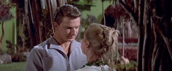 Movie still from “Forbidden Planet” (1956), directed by Fred M. Wilcox – A man and a woman talking to each other; Close Up shot, Low angle