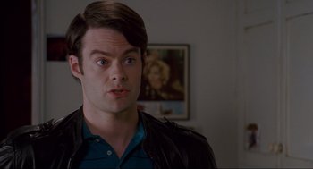 Movie still from “Forgetting Sarah Marshall” (2008), directed by Nicholas Stoller – A man in a leather jacket looking at the camera; Close Up shot, Over the shoulder angle