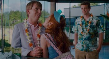 Movie still from “Forgetting Sarah Marshall” (2008), directed by Nicholas Stoller – A man and a woman standing next to each other in front of a building; Medium shot, Over the shoulder angle