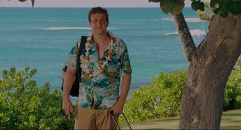 Movie still from “Forgetting Sarah Marshall” (2008), directed by Nicholas Stoller – A man standing next to the ocean holding a golf club; Wide shot, Over the shoulder angle