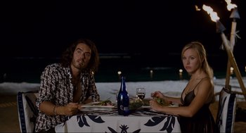 Movie still from “Forgetting Sarah Marshall” (2008), directed by Nicholas Stoller – A man and a woman sitting at a dinner table; Medium shot, High angle