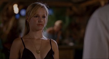 Movie still from “Forgetting Sarah Marshall” (2008), directed by Nicholas Stoller – A beautiful blonde woman wearing a black dress; Close Up shot, Over the shoulder angle