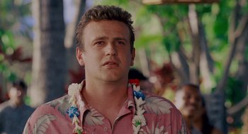 Movie still from “Forgetting Sarah Marshall” (2008), directed by Nicholas Stoller – A person wearing a hawaiian shirt; Close Up shot, Over the shoulder angle