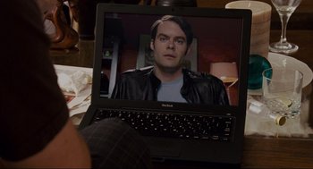 Movie still from “Forgetting Sarah Marshall” (2008), directed by Nicholas Stoller – A man sitting in front of a laptop computer; Close Up shot, Over the shoulder angle