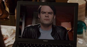 Movie still from “Forgetting Sarah Marshall” (2008), directed by Nicholas Stoller – A laptop with a picture of jack black on the screen; Close Up shot, Over the shoulder angle