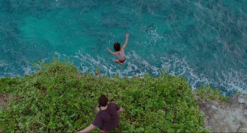 Movie still from “Forgetting Sarah Marshall” (2008), directed by Nicholas Stoller – A person jumping off a cliff into the ocean; Extreme Wide shot, Overhead angle