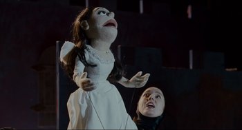 Movie still from “Forgetting Sarah Marshall” (2008), directed by Nicholas Stoller – A woman in a white dress and a man in a black suit; Medium shot, Low angle