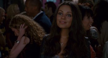 Movie still from “Forgetting Sarah Marshall” (2008), directed by Nicholas Stoller – A beautiful young woman with long brown hair and blue eyes; Close Up shot, Over the shoulder angle